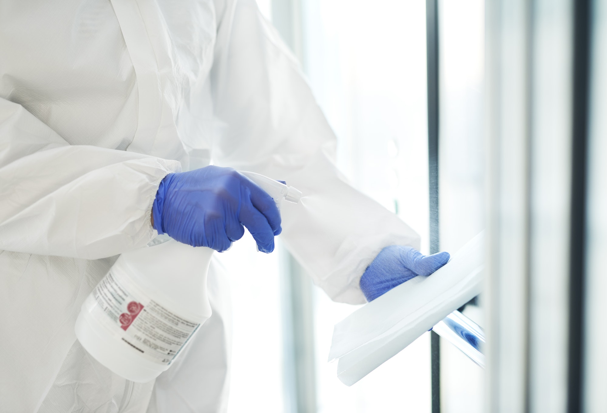 Indoors disinfection by a person in protective suit